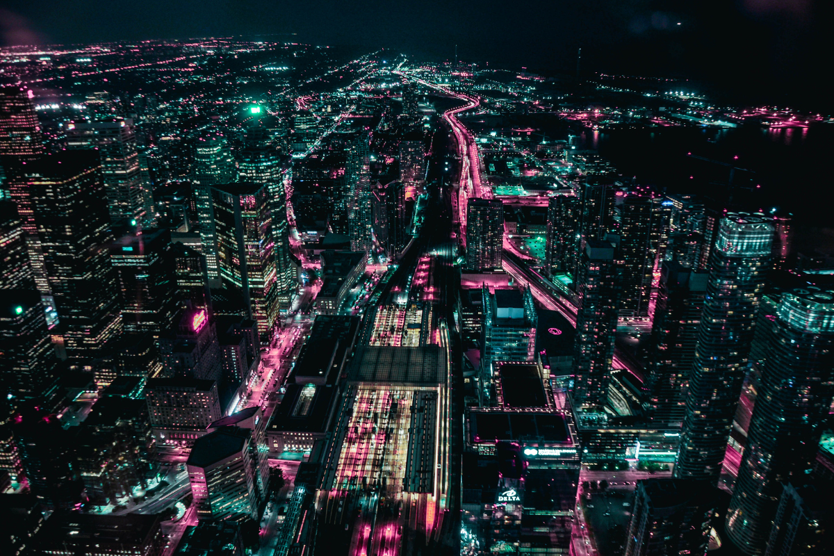 Aerial view of a brightly lit city at night showing light pollution.